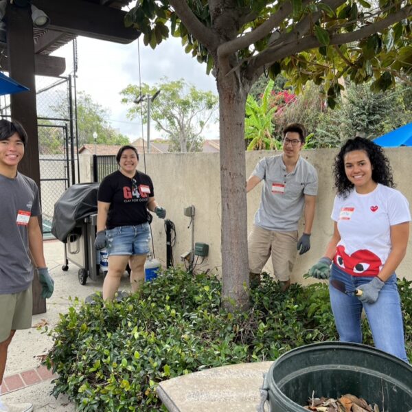 4 volunteers gardening outside